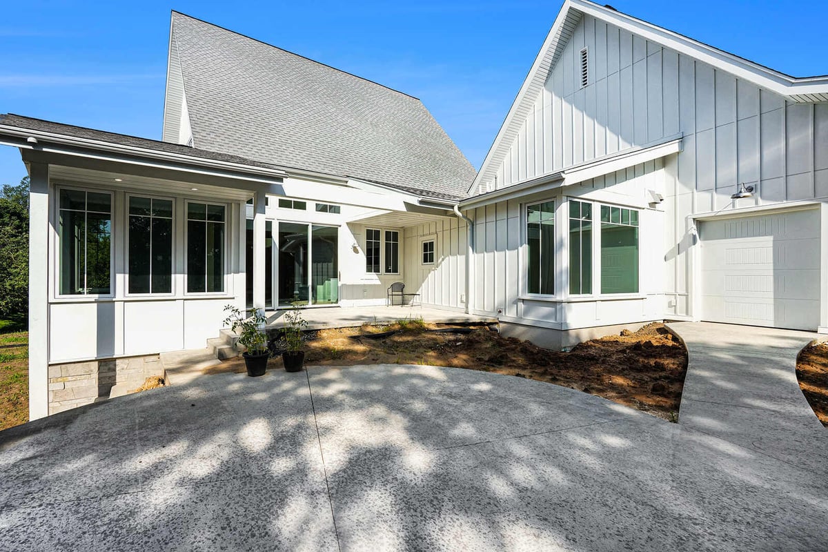 Rear courtyard of a modern farmhouse in West Michigan, built by R Value Homes