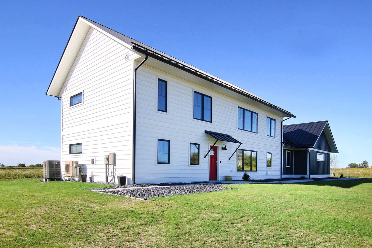 Side view of a custom-built home by R-Value Homes in West Michigan with clean lines and contemporary siding