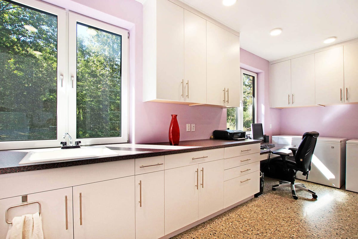 Custom-designed office space with ample cabinetry and natural light, part of a West Michigan home by R Value Homes