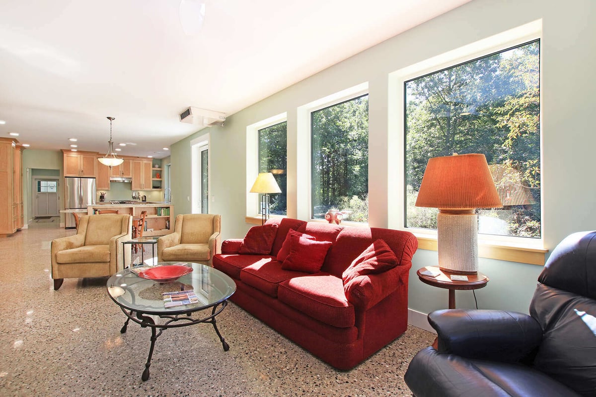 Open-concept living room and kitchen in a custom West Michigan home, designed by R Value Homes